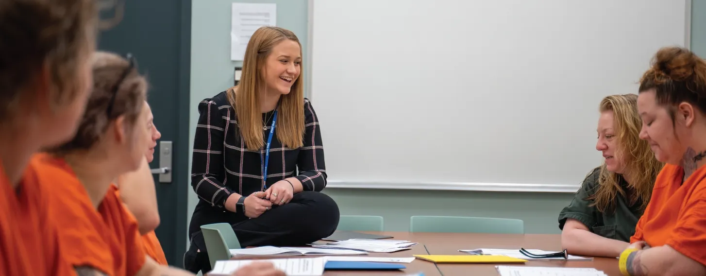 Forensic psychology student leading a group in a local jail setting.